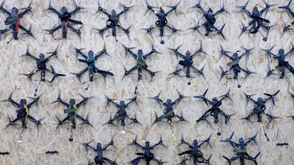 FPV training drones hanging on a wall inside the Killhouse Academy drone training center in Kyiv