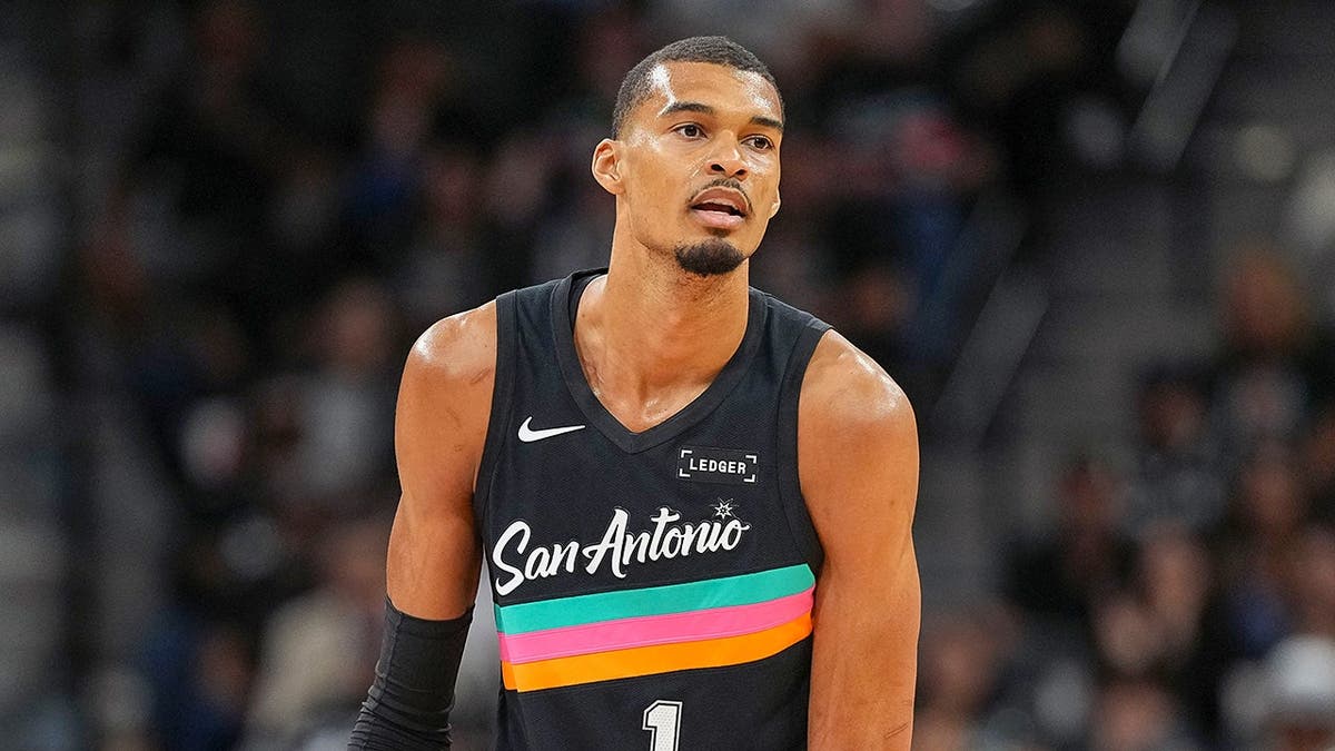 San Antonio Spurs forward Victor Wembanyama dribbling basketball during game at Frost Bank Center