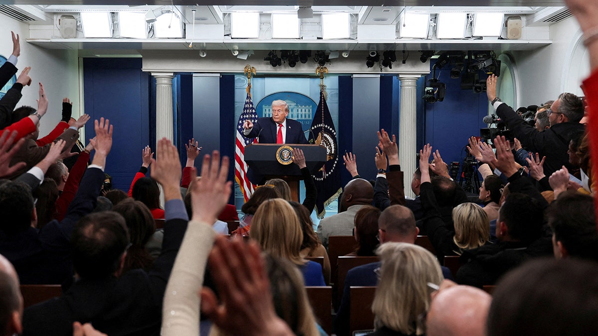 U.S. President Donald Trump taking questions from reporters during a press briefing at the White House.