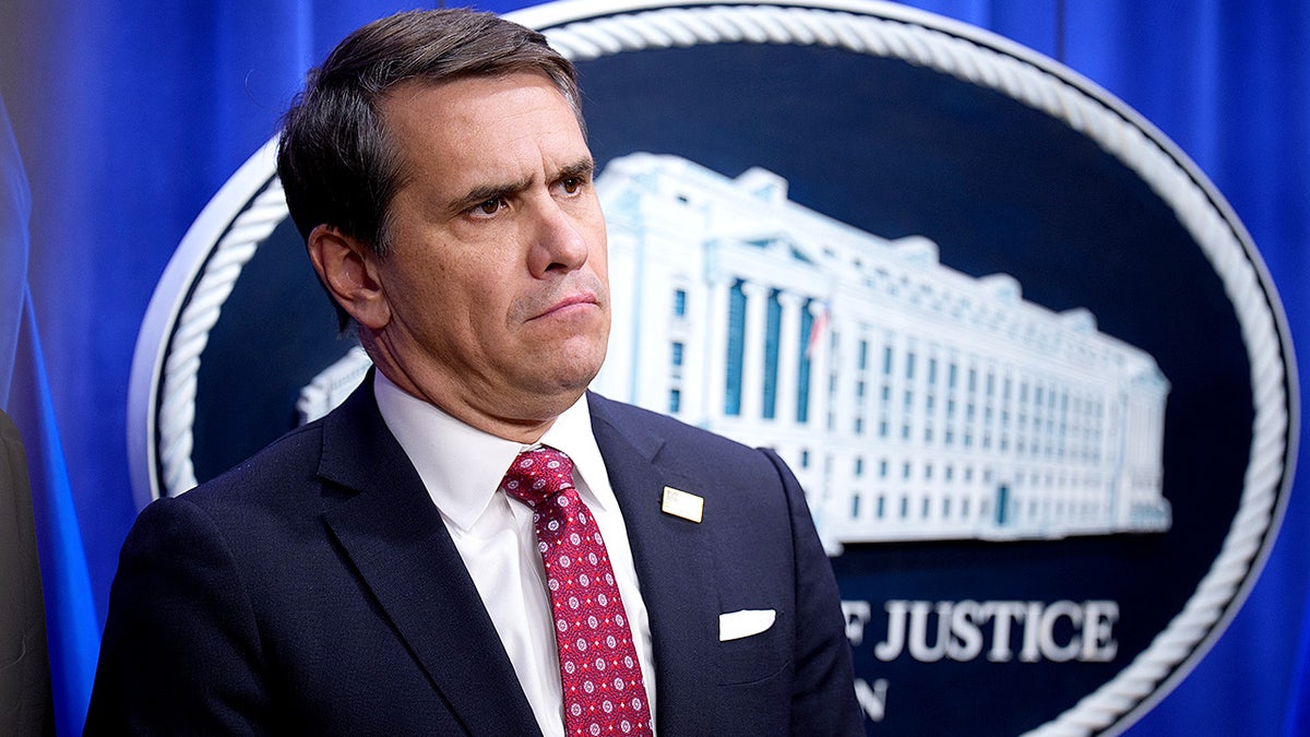 Deputy Attorney General Todd Blanche standing near a podium at the Justice Department in Washington, D.C.