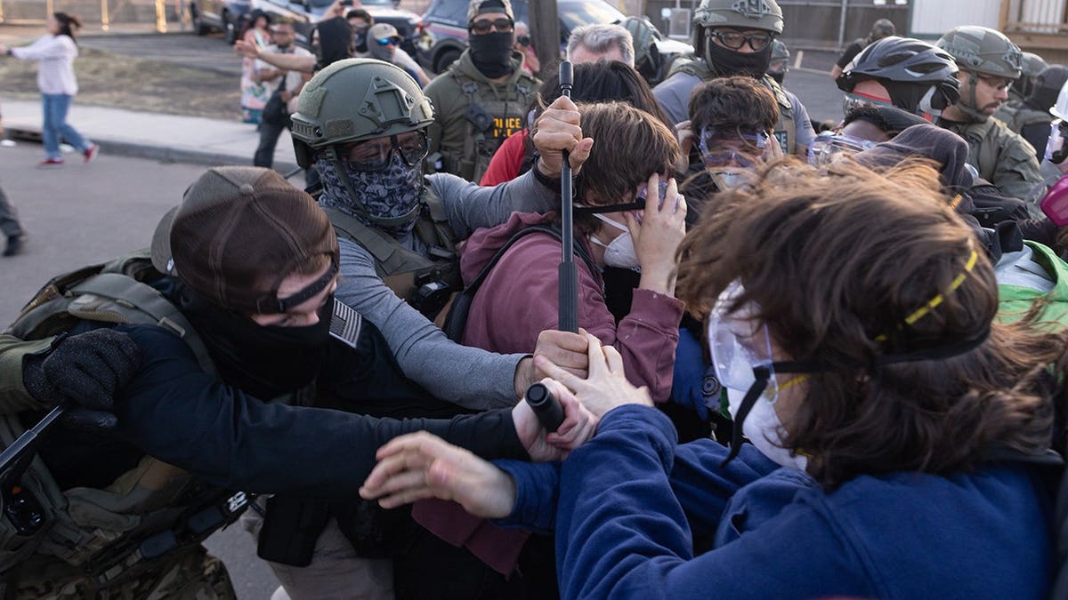 Federal immigration officers clashing with protesters outside Delaney Hall in Newark, New Jersey