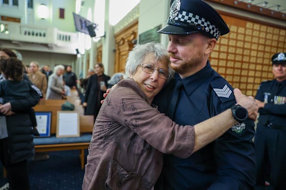Dettman is on Friday congratulated by his mother, Anne.