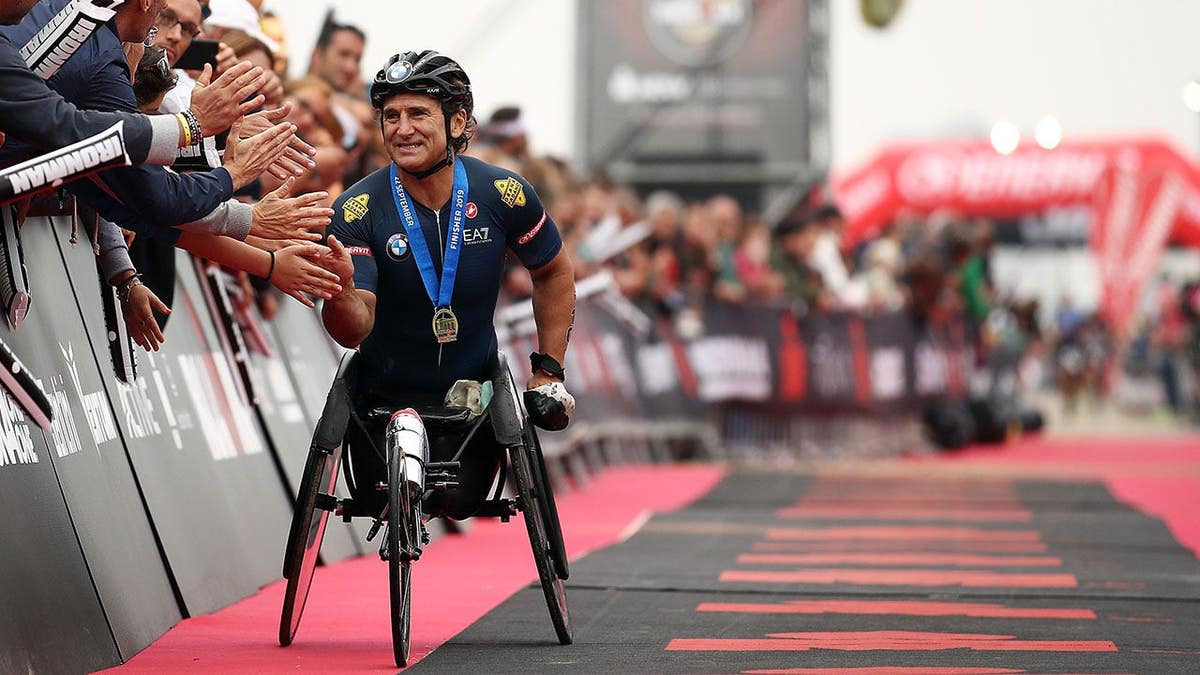 Alex Zanardi crossing the finish line at IRONMAN 70.3 Emilia Romagna