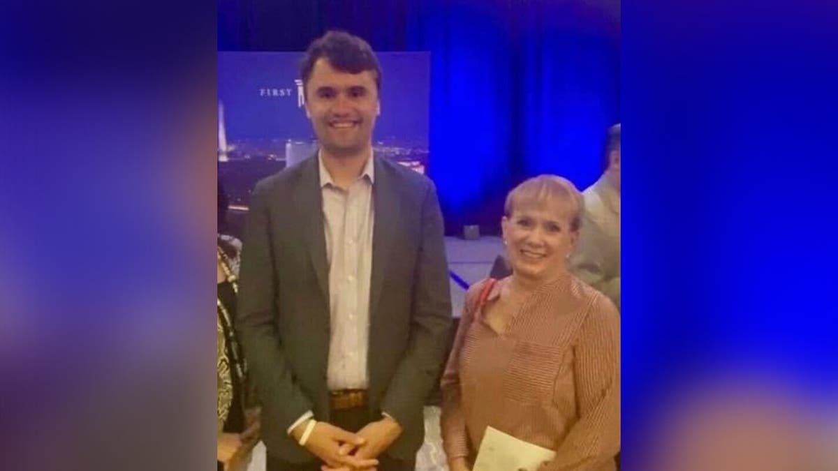 Karen Whitaker standing with Charlie Kirk