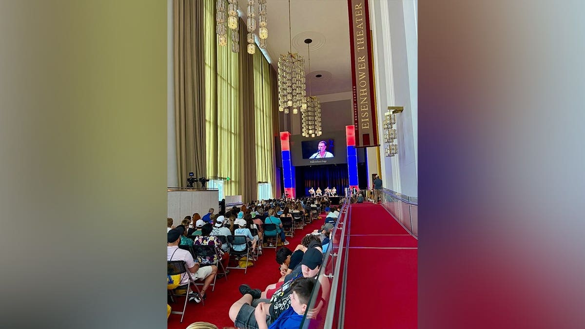 A packed audience watches veterans perform during the