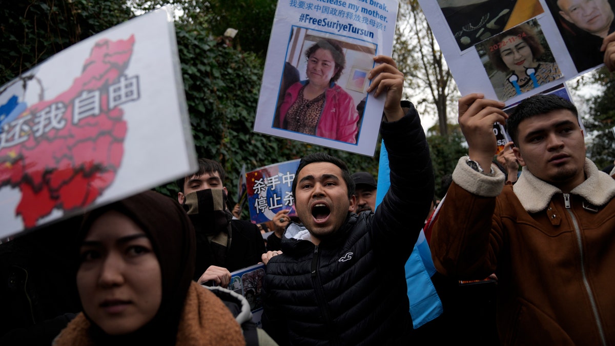 Protesters chanting and holding posters in front of Chinese consulate in Istanbul