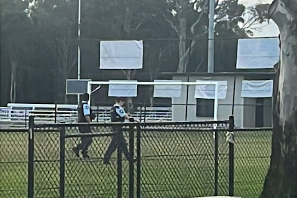 Police search for evidence at Auburn after two men allegedly tried to snatch a woman off the street at knife-point.