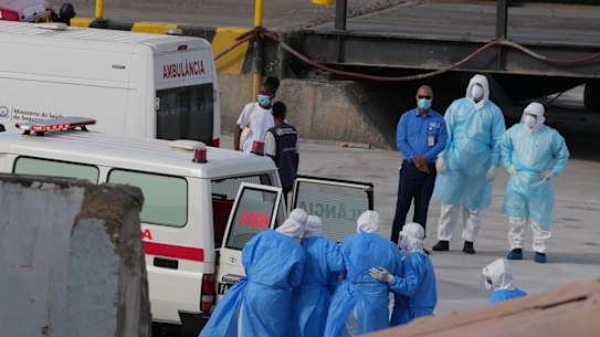 Health workers in protective gear evacuate patients from the MV Hondius cruise ship into an ambulance at a port in Praia, Cape Verde on Wednesday.