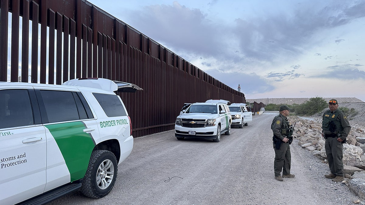 US Border Patrol agents securing the border fence in El Paso, Texas