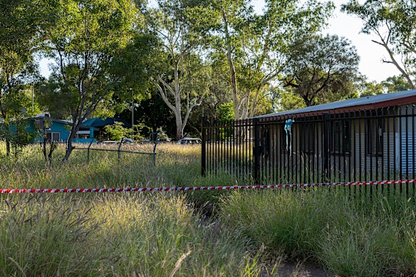 A taped-off area and a hole in a fence are seen at the rear of the Old Timers Camp on Wednesday.