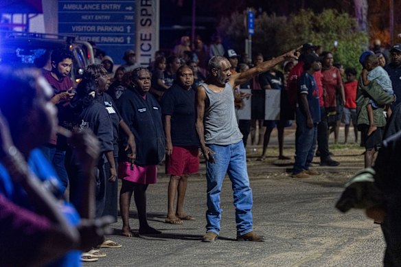 Community members protest outside Alice Springs Hospital on Thursday night following the arrest of Jefferson Lewis.