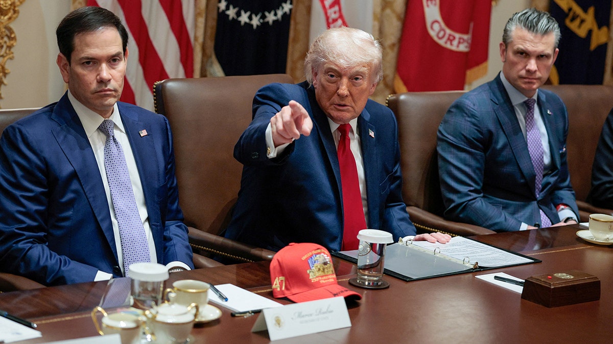 U.S. President Donald Trump seated with Secretary of State Marco Rubio and Defense Secretary Pete Hegseth in the White House Cabinet Room