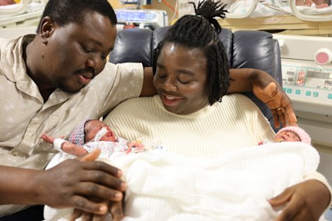 Belinda and Emmanuel Lotsu with two of their four newborns.