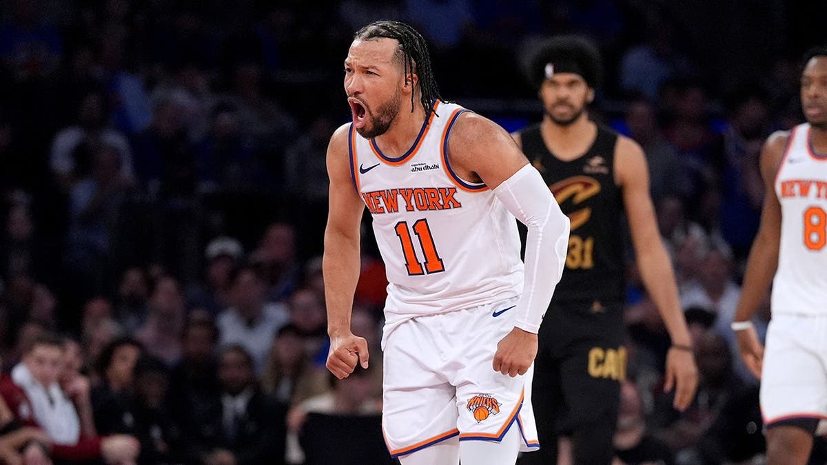 New York Knicks' Jalen Brunson reacting after scoring a basket during a basketball game.