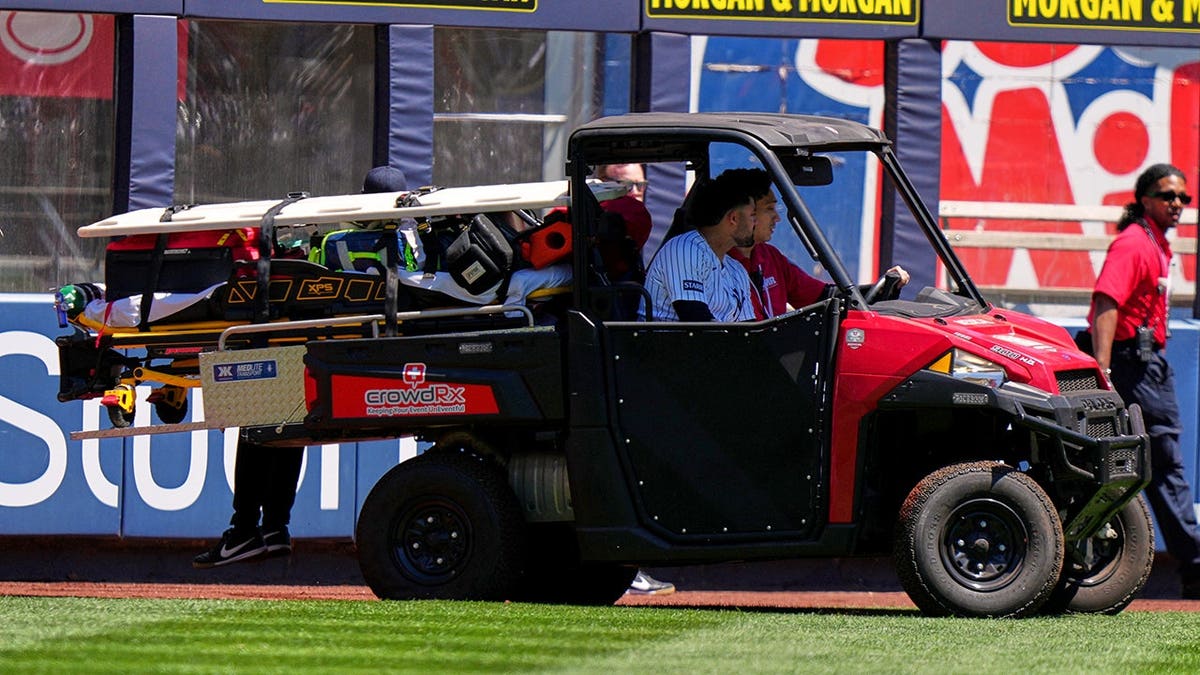 New York Yankees' Jasson Domínguez being carted off the field
