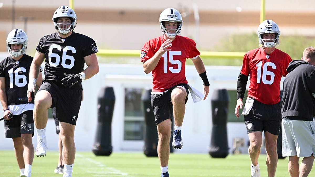 Las Vegas Raiders quarterback Fernando Mendoza warming up at rookie minicamp