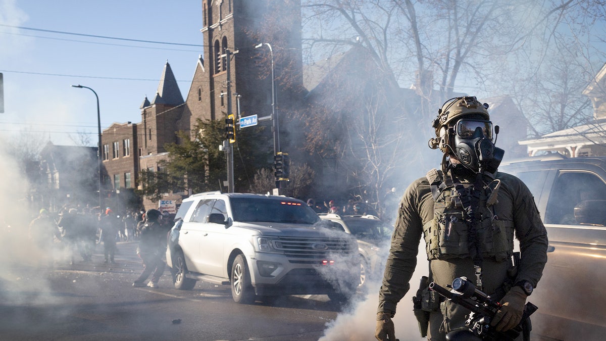 Federal immigration agents tossing tear gas during a house raid in Minneapolis Minnesota
