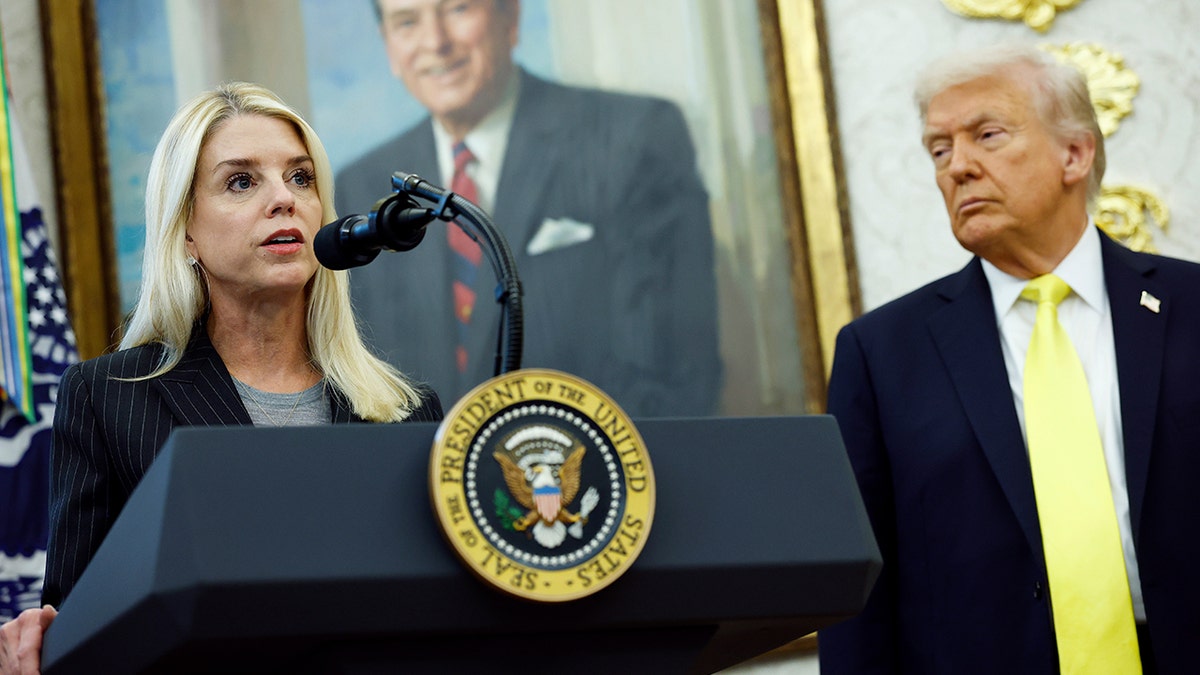 U.S. Attorney General Pam Bondi speaking in the Oval Office with President Donald Trump looking on