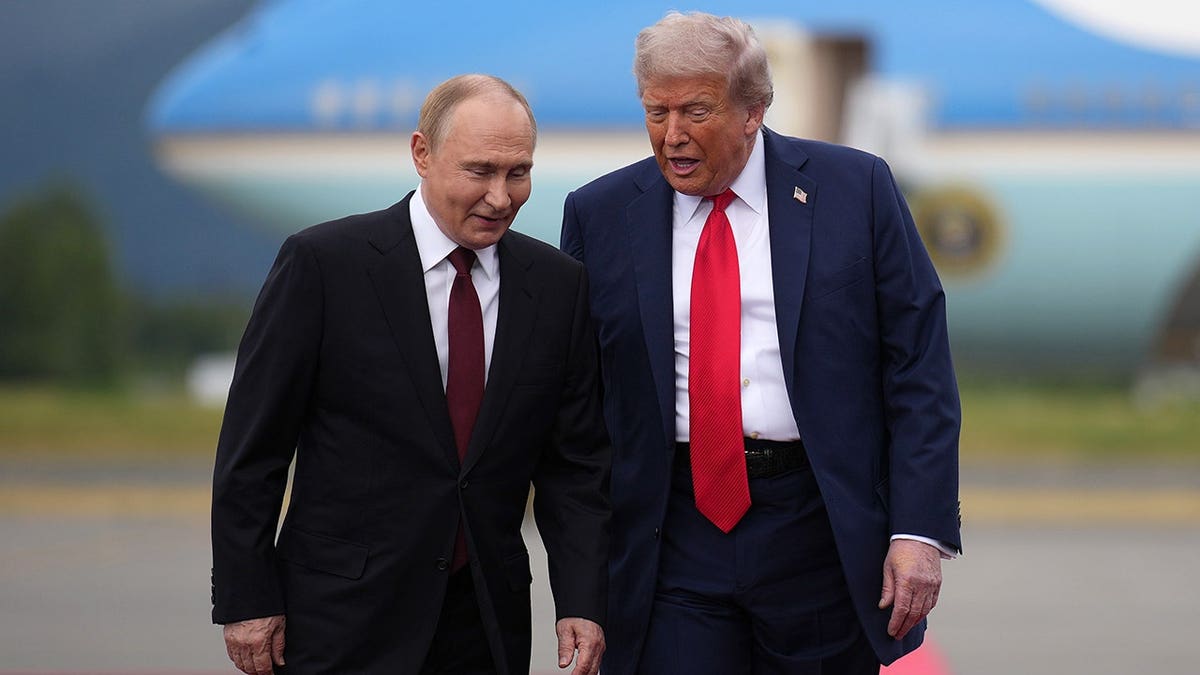 U.S. President Donald Trump walking with Russian President Vladimir Putin at Joint Base Elmendorf-Richardson