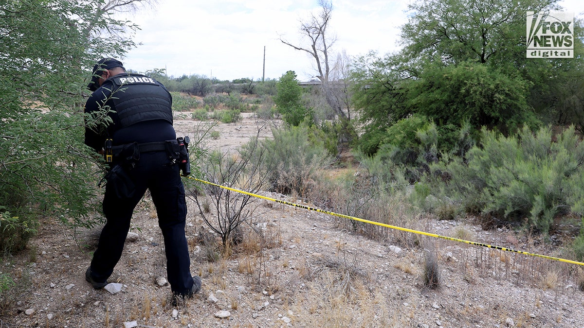 Tucson police respond to the site where human remains were found in an ephemeral river while searching for Nancy Guthrie.