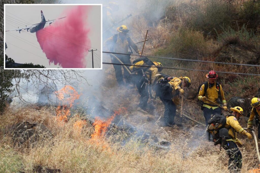 Wildfire explodes across Wine Country as firefighters battle strong winds and steep hills