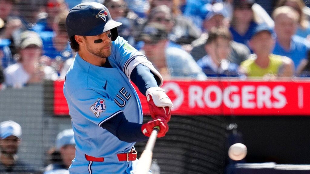 Blue Jays rally while Orioles' double-play attempt negated as umps rule infielder failed to try to tag runner