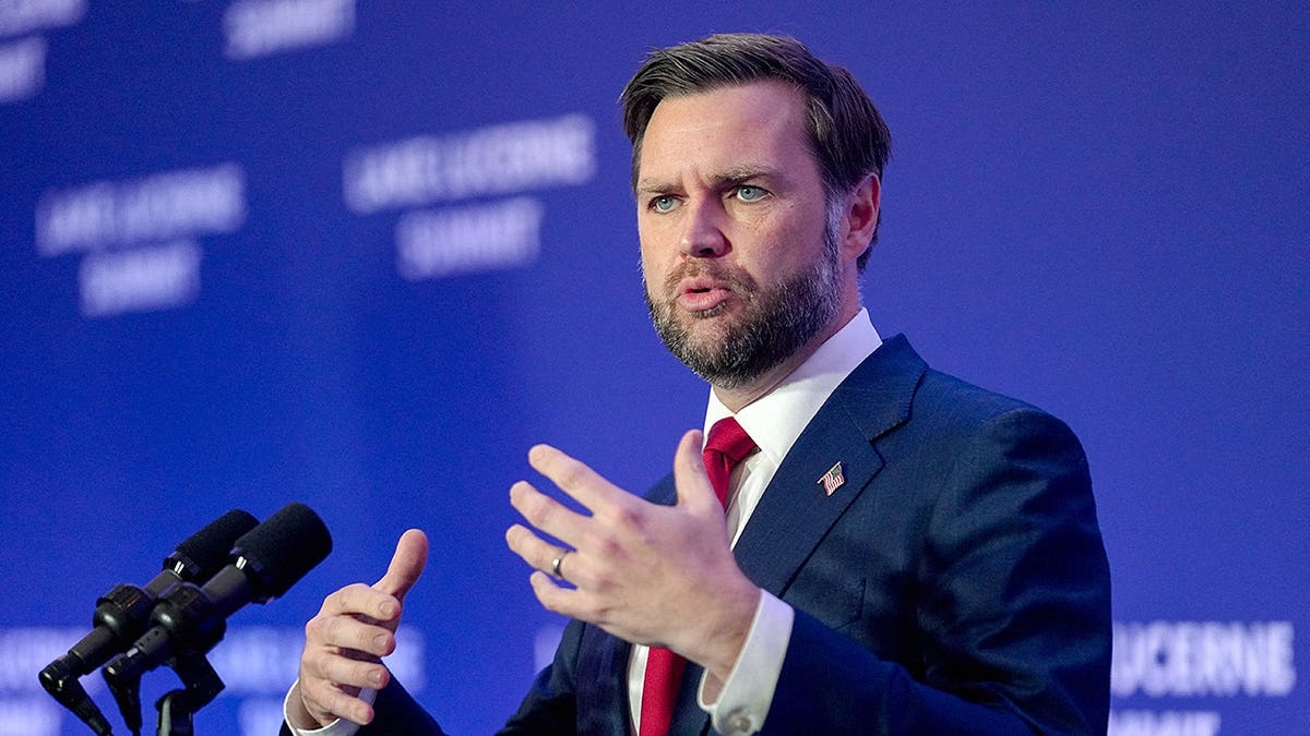 JD Vance speaking into a microphone.