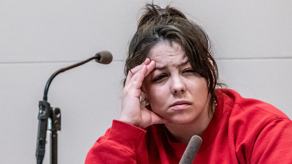 Kayla Montgomery reacting to a migraine headache while testifying in court