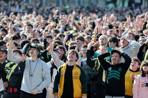 Fans watching the game at Federation Square in Melbourne.
