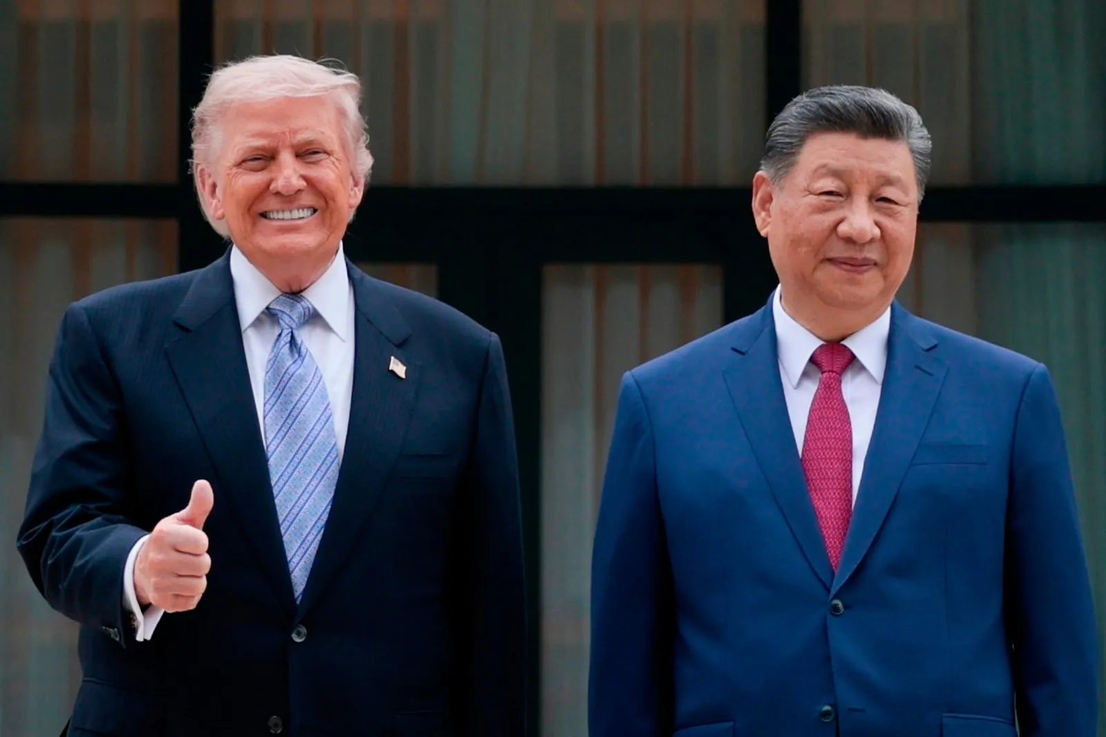President Donald Trump poses for a picture with Chinese President Xi Jinping during a visit to the Zhongnanhai Garden in Beijing on May 15. (Evan Vucci/Pool Photo via AP)