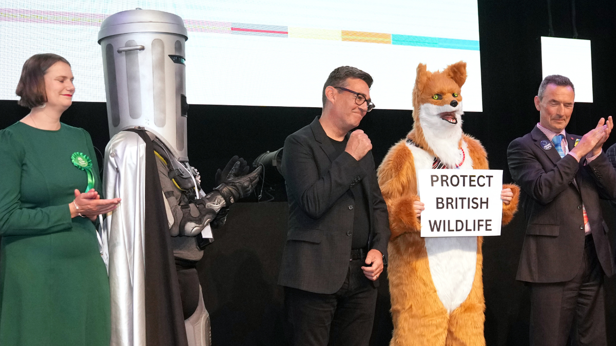 Labour party candidate Andy Burnham stands with other candidates awaiting the election results on Friday, June 19, 2026