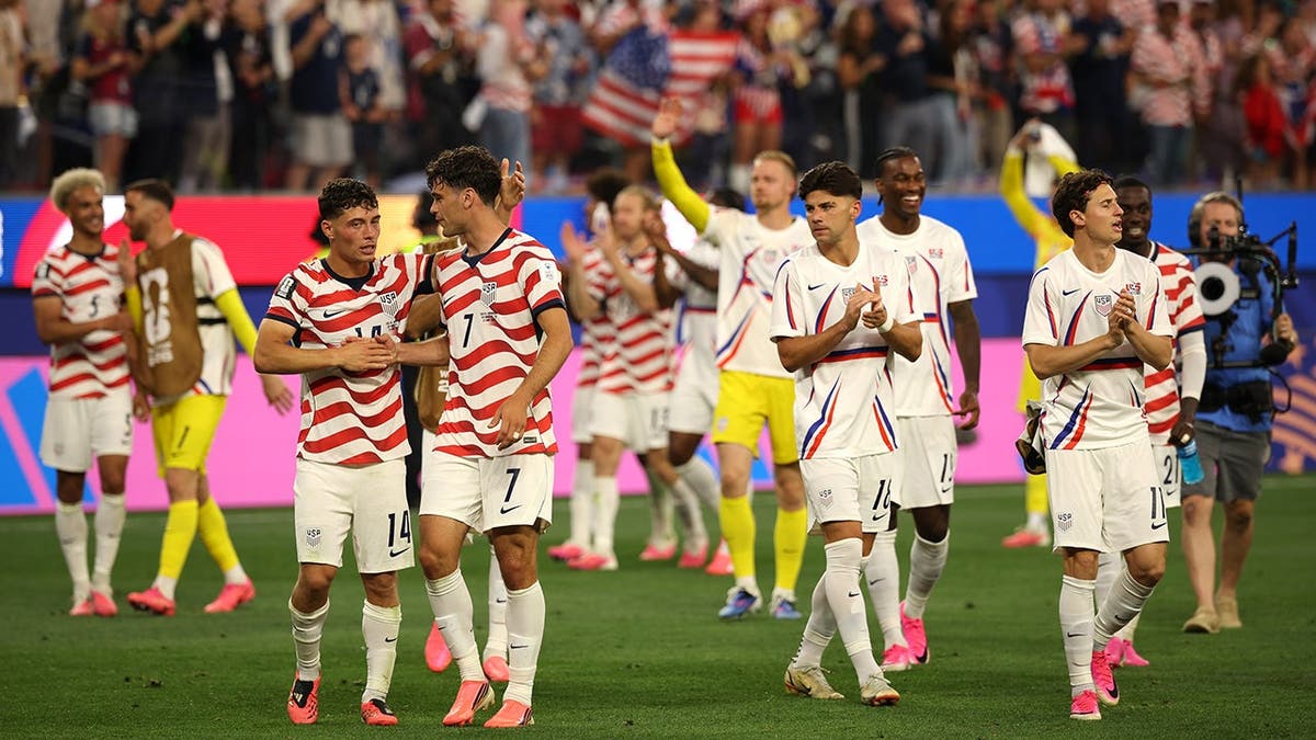 U.S. men's national team players celebrate after a soccer match