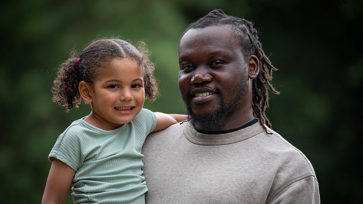 Anthony and Amelia Kalejaiye smile.