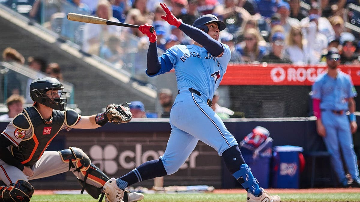 Toronto Blue Jays' Brandon Valenzuela hitting a home run during a baseball game in Toronto