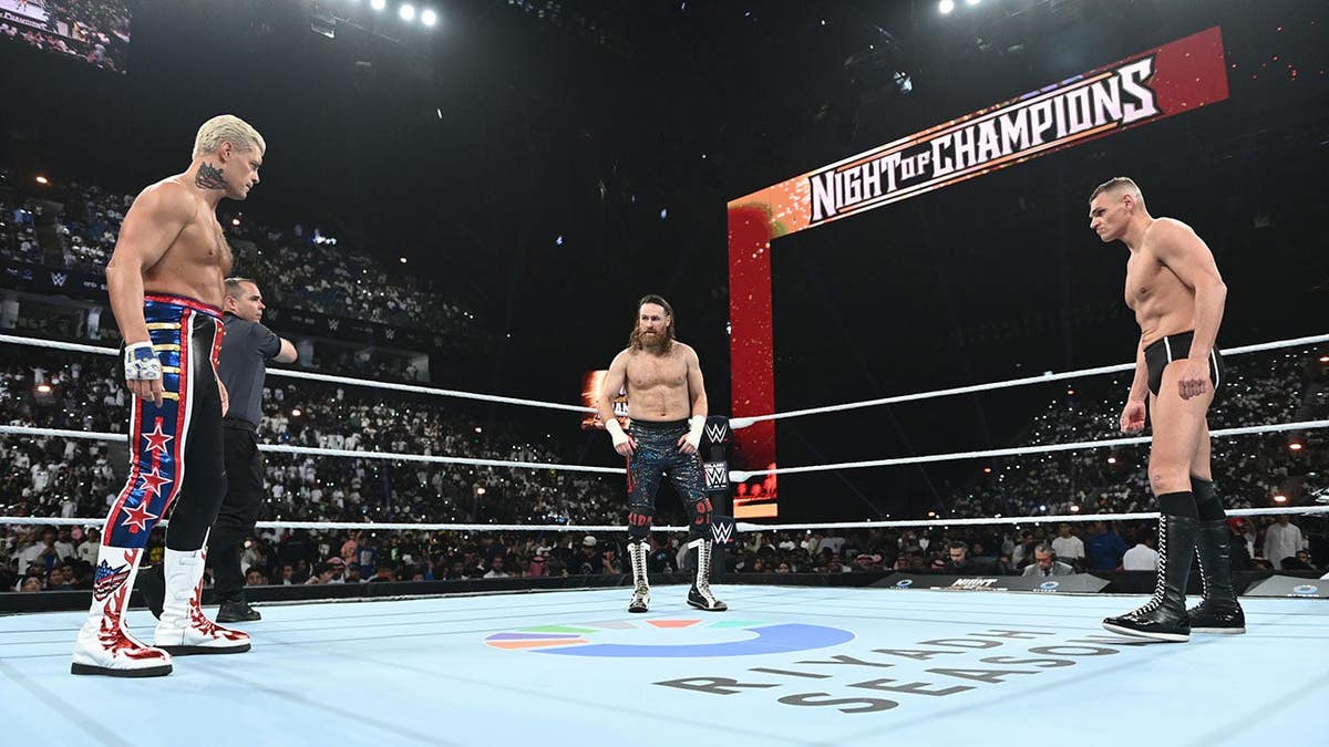 Cody Rhodes, Sami Zayn and Gunther facing off in a wrestling ring.