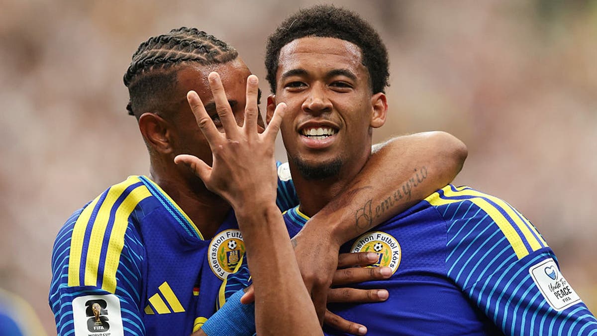 Livano Comenencia #8 of Curacao celebrates with Juninho Bacuna #7 after scoring the team's first goal during the FIFA World Cup