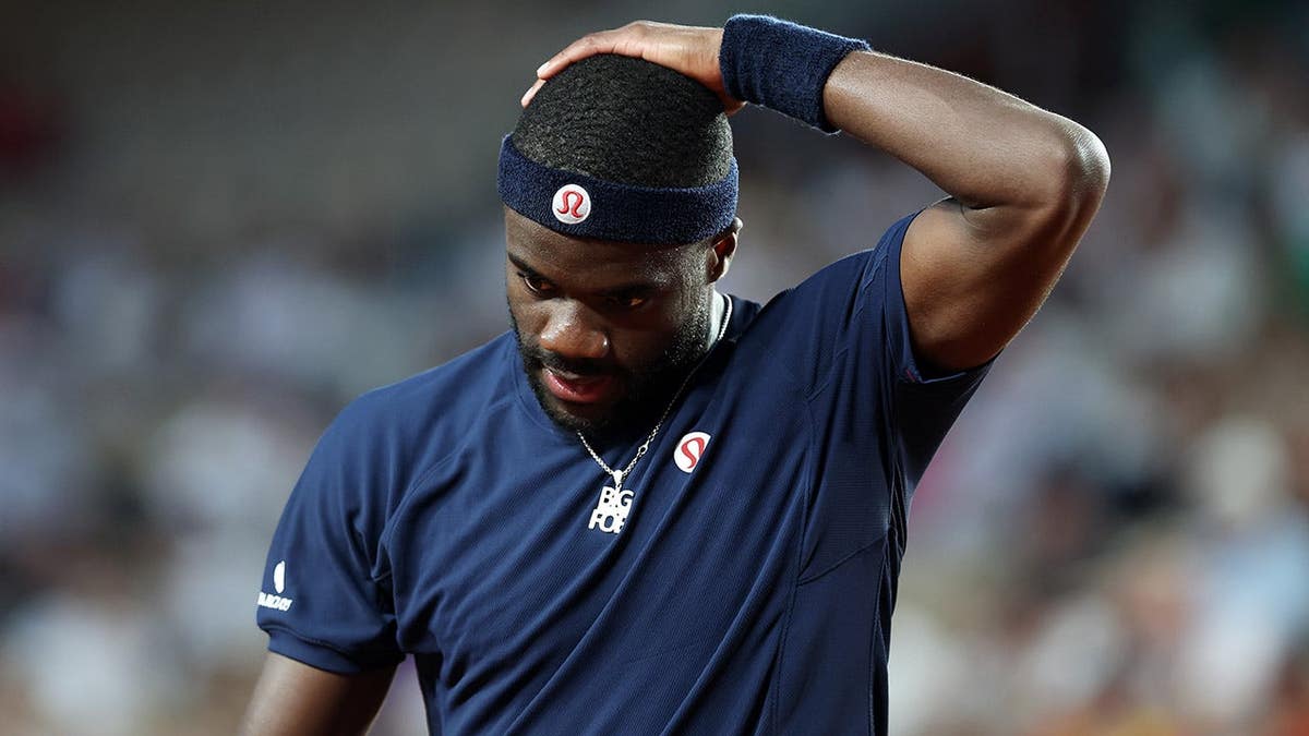 Frances Tiafoe reacting during a tennis match against Matteo Arnaldi at the French Open.