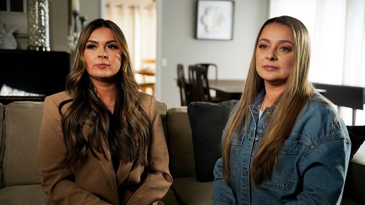 Melissa Fielder and Sara Dickerson sitting together on a couch.