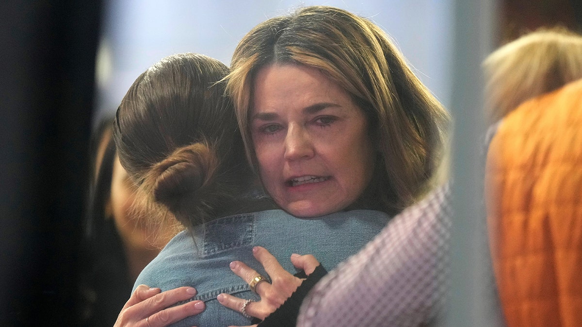 Savannah Guthrie hugging a staff member at the Today show studio in New York