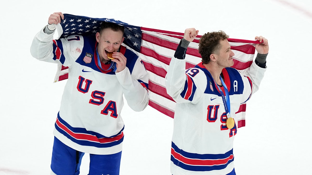 Brady Tkachuk and Matthew Tkachuk celebrating on ice hockey rink
