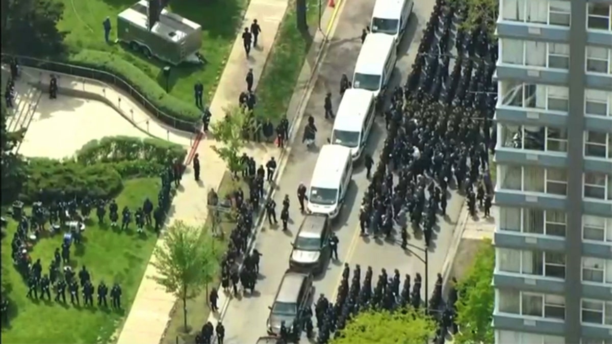 Police officers standing in formation during a funeral service