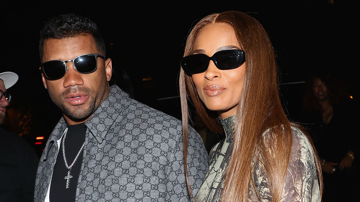 Russell Wilson and Ciara standing together at a birthday celebration in New York City