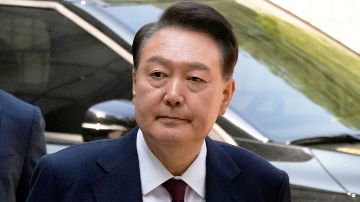 South Korea's ousted former President Yoon Suk Yeol arriving at Seoul Central District Court