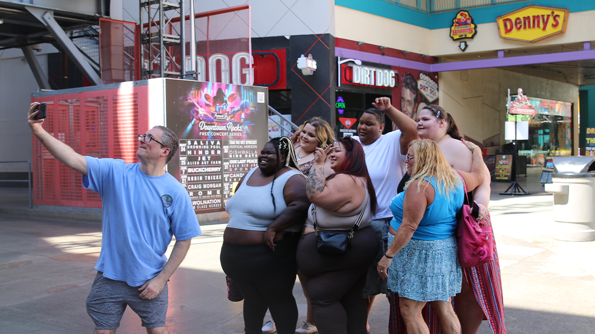 Stefan Wilhelmy takes a selfie with members of the Pearadise community in downtown Las Vegas