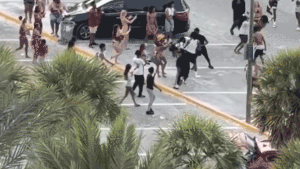 A crowd of teenagers gathered at a Florida beach during a chaotic event