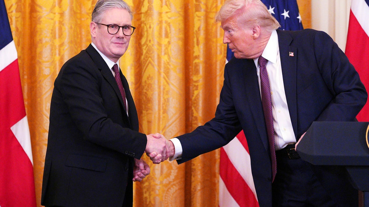 Britain's Prime Minister Keir Starmer and U.S. President Donald Trump shaking hands in the White House East Room