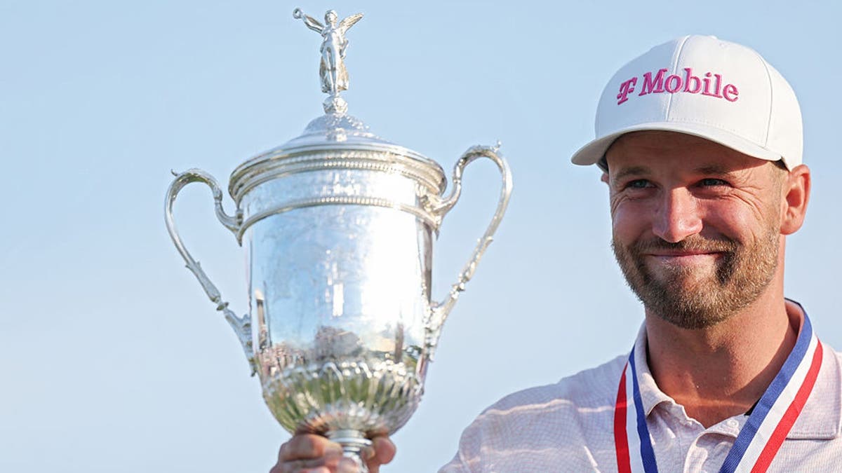 Wyndham Clark of the United States poses with the U.S. Open Championship Trophy
