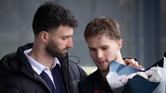 Epping Football Netball Club president Luke De Vincentis (left) with Matthew Fitzgerald, brother of Nathan Fitzgerald. Nathan died as a result of head injuries sustained during a match at the weekend.