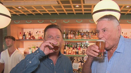 Arthur Laundy shares a beer with Ben Fordham after it was announced that Nine Entertainment sold its radio networks, including 2GB and 3AW.