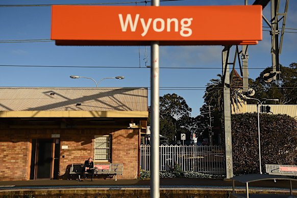 A man waits for a train at Wyong, one of the few options for public transport on the coast.